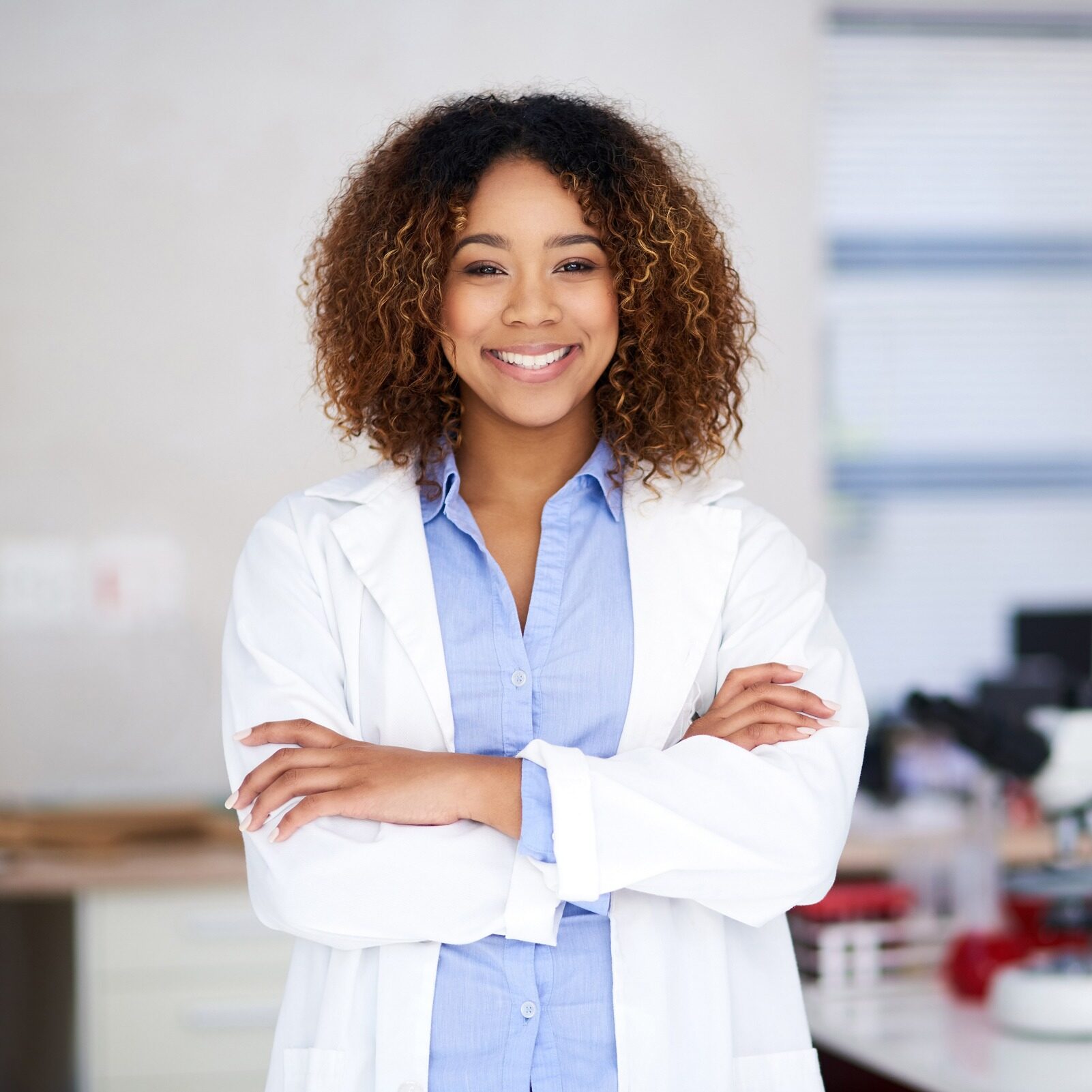 endodontist Young female endodontist smiling at camera